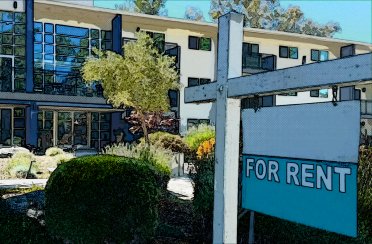 An image of an apartment building with a sign in front that says “for rent.”