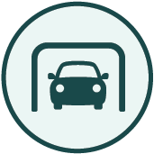 Icon representing enclosed parking facilities. Silhouette of a car parked in a port.